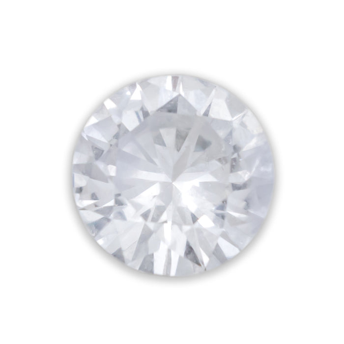 A round cut white sapphire against a white background